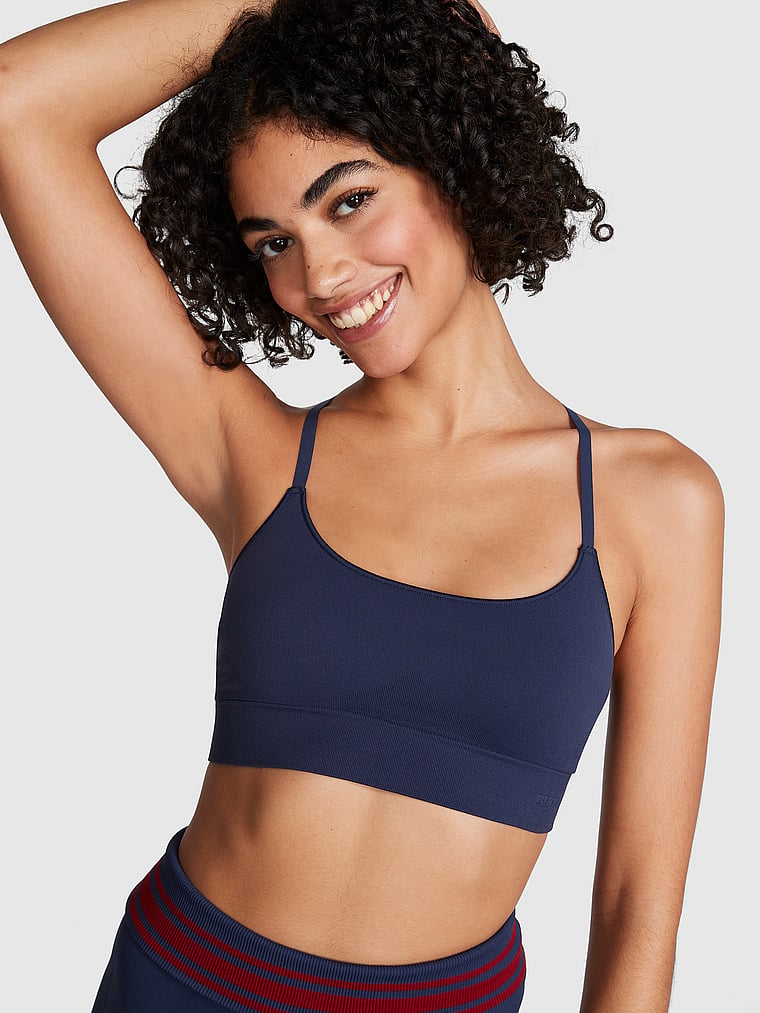 PINK Seamless Scoop Racerback Sports Bra, Midnight Navy, onModelFront, 1 of 4 Vanessa is 5'10" and wears 32B or Small
