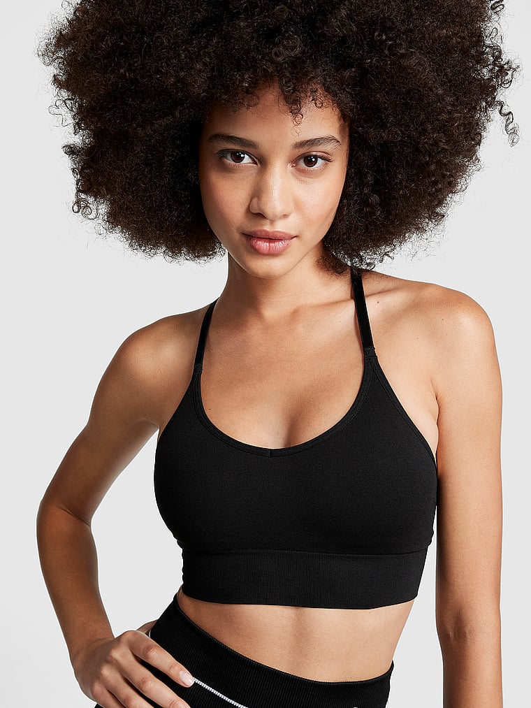 PINK Seamless Racerback Sports Bra, Pure Black, onModelFront, 1 of 5 Yoly is 5'8" and wears 32B or Small