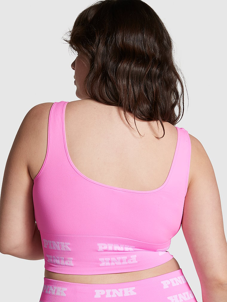 PINK new Seamless Logo Sports Bra, Lola Pink, onModelBack, 2 of 4 Sixtine  is 5'7" and wears 36D or Medium