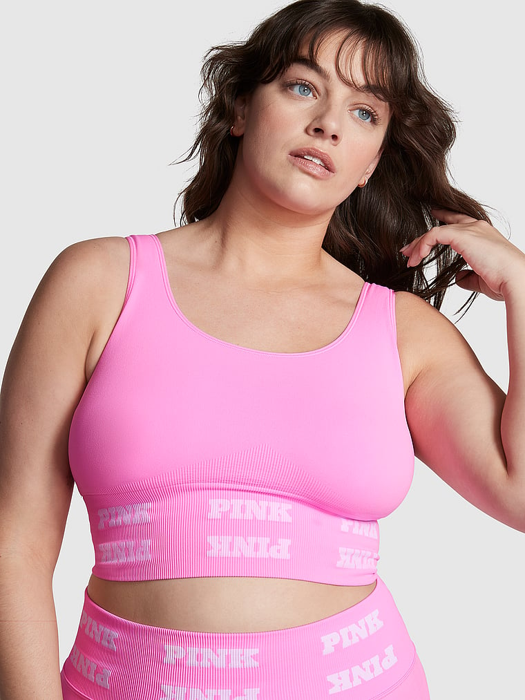 PINK new Seamless Logo Sports Bra, Lola Pink, onModelFront, 1 of 4 Sixtine  is 5'7" and wears 36D or Medium