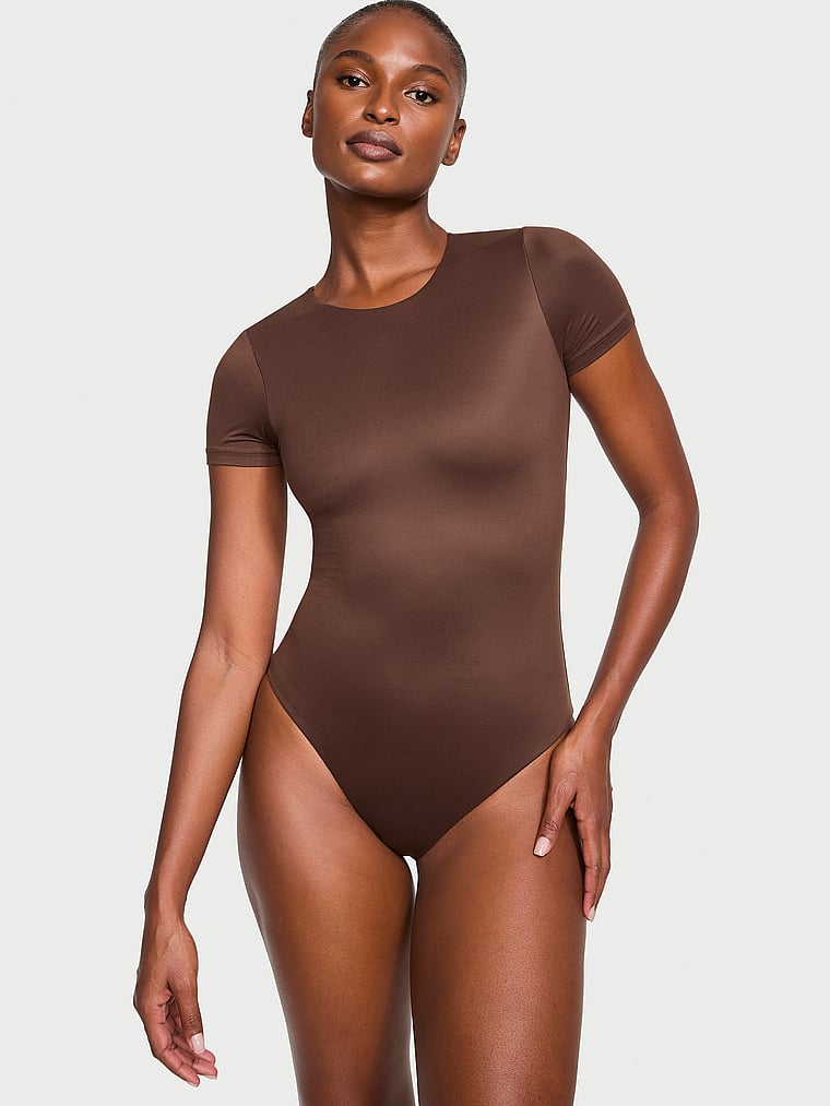 Victoria's Secret, Victoria's Secret Feathersoft Essentials Short-Sleeve Bodysuit, Brown, onModelFront, 1 of 3 Tsheca  is 5'9" and wears Small