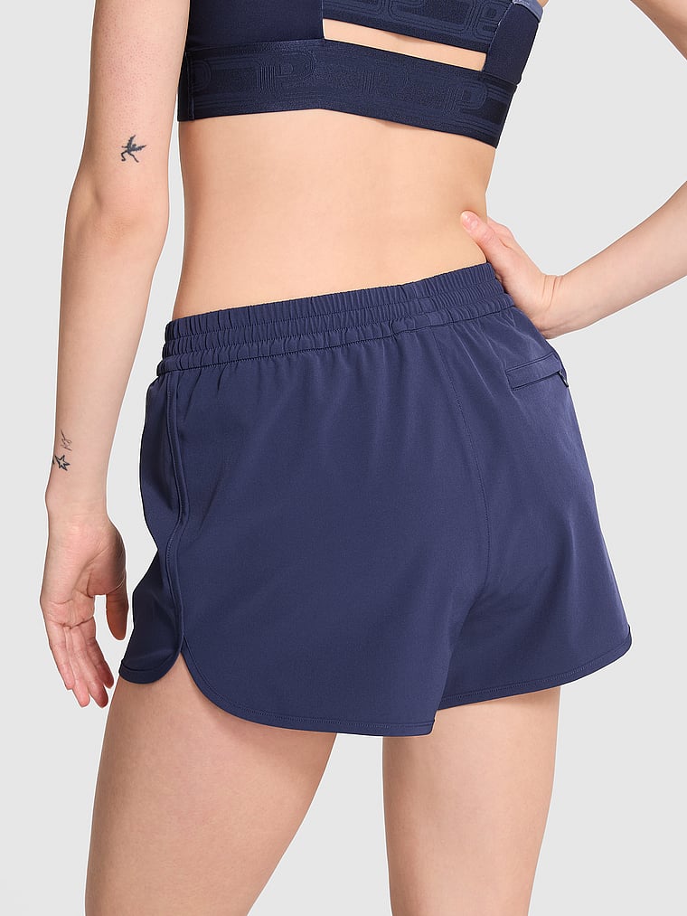 PINK Tech Stretch Running Shorts, Midnight Navy, onModelBack, 4 of 4 Sofia is 5'10" and wears Small