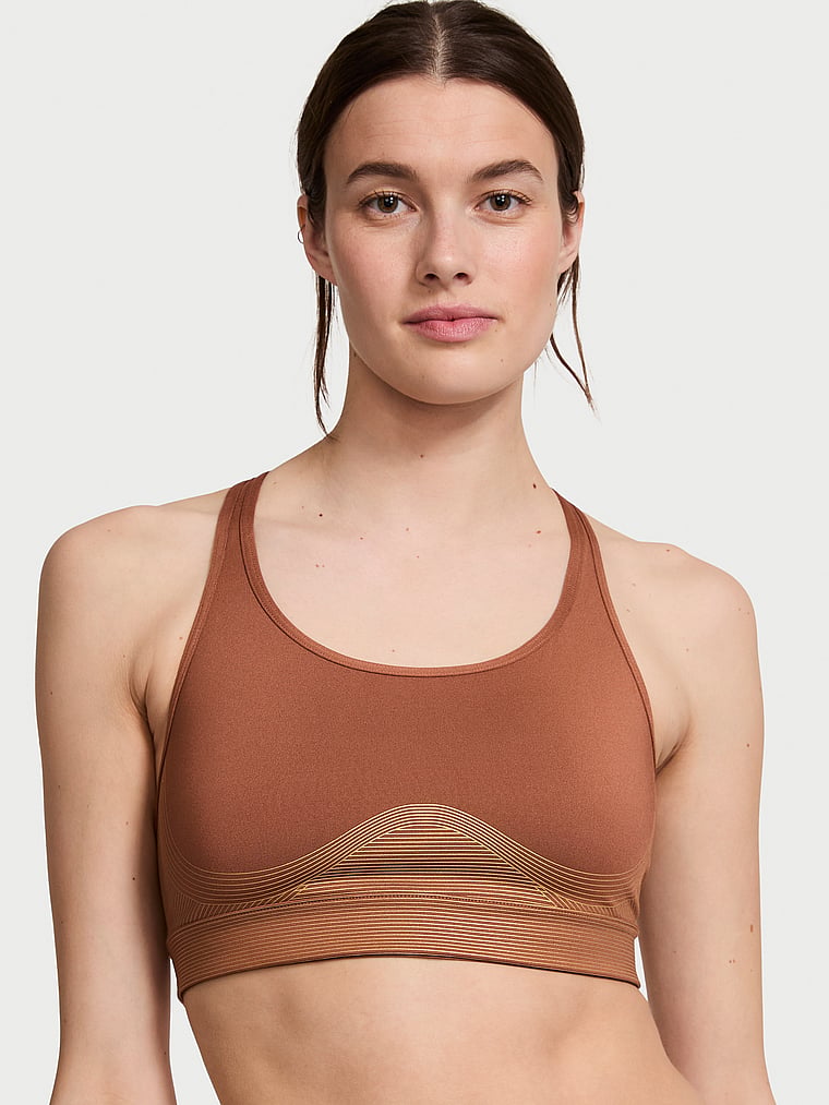 Victoria's Secret, VSX Player Shine Sports Bra, Caramel Bronze, onModelFront, 1 of 4 Mackenzie is 5'10" and wears 34B or Small