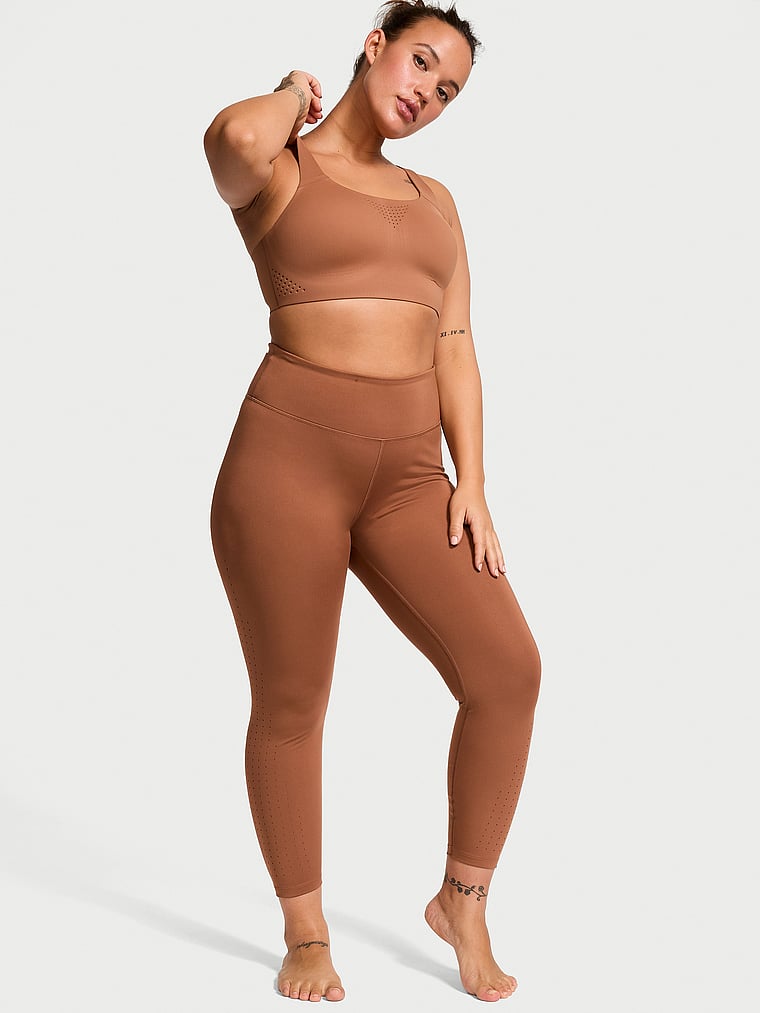 Victoria's Secret, VSX VS Essential High-Rise Perforated Leggings, Caramel, onModelFront, 1 of 5 Sofia  is 5'8" or 173cm and wears Large