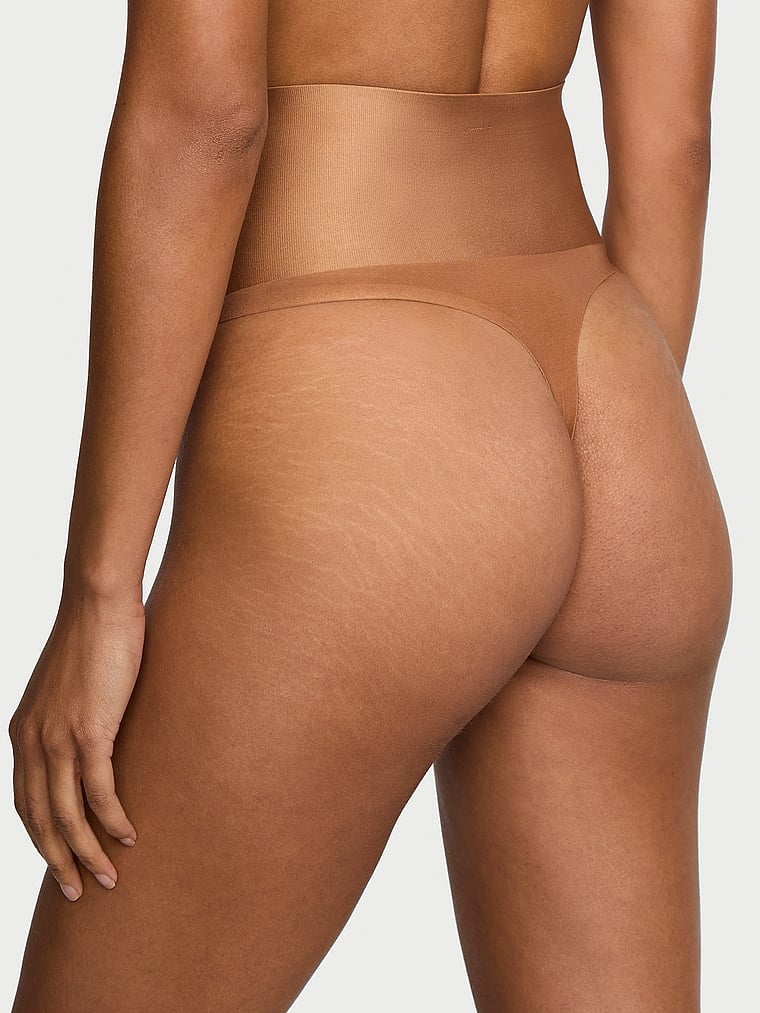 Victoria's Secret, Body by Victoria SmoothingShimmer™ Thong Panty, Caramel, onModelBack, 2 of 3 Daiane is 5'11" and wears Small