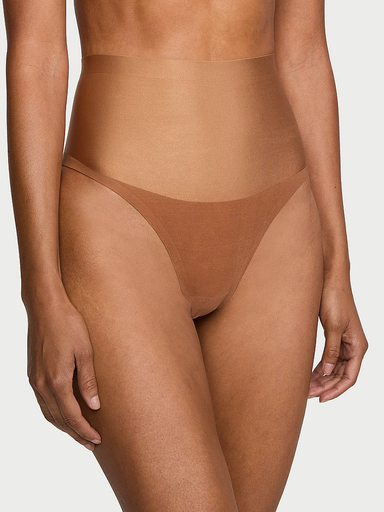 Victoria's Secret, Body by Victoria SmoothingShimmer™ Thong Panty, Caramel, onModelFront, 1 of 3 Daiane is 5'11" and wears Small