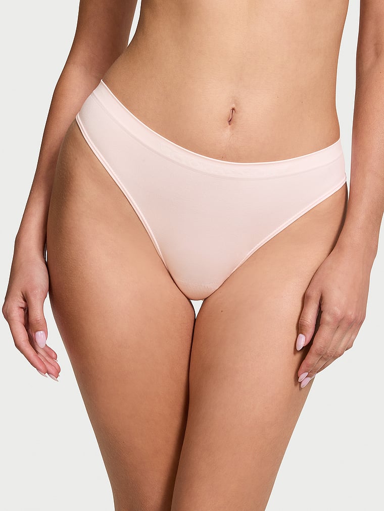 Victoria's Secret, Seamless Seamless Thong Panty, Purest Pink, onModelFront, 1 of 3 Ari is 5'9" and wears Small