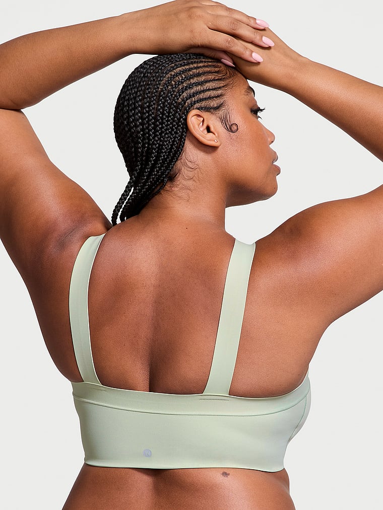Victoria's Secret, VSX VSX Elevate™ Cross-Strap Bandeau Sports Bra, Soft Green, onModelBack, 4 of 4 Brianna is 5'10" and wears 38DD (E) or Extra Large