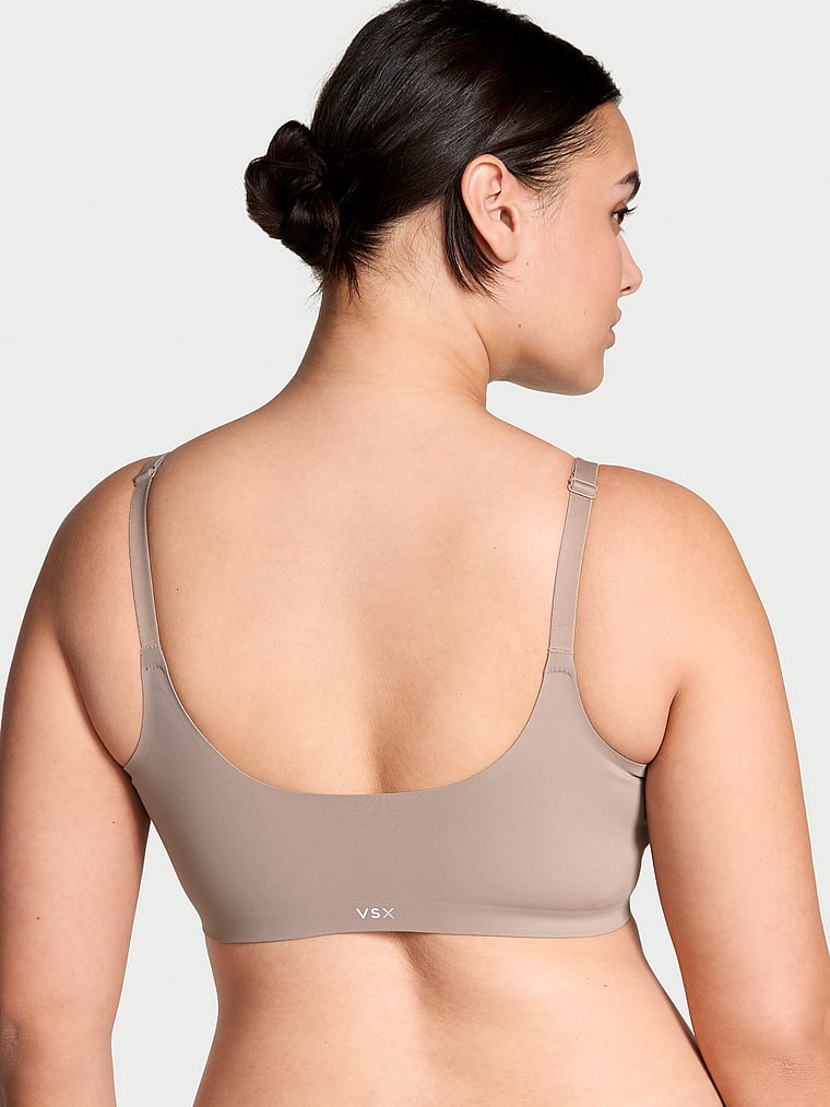 Victoria's Secret, VSX VSX Elevate™ Stretch-Comfort Sports Bra, Bare Taupe, onModelBack, 2 of 4 Karmi is 5'10" and wears 34DD (E) or Large