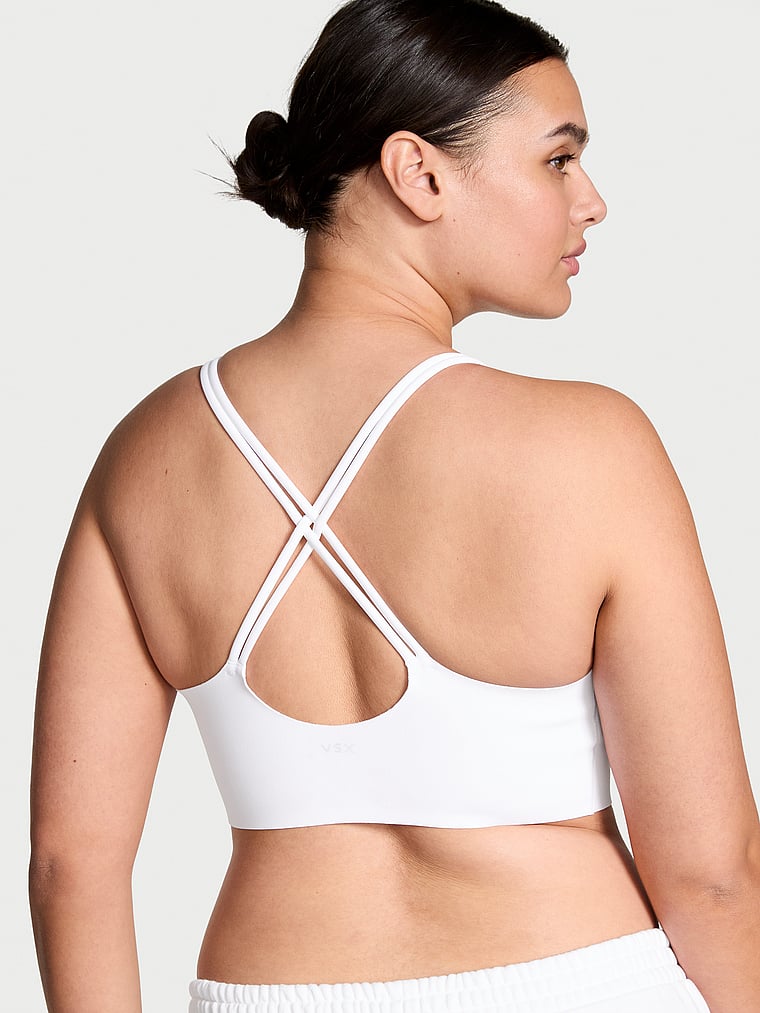 Victoria's Secret, VSX VSX Elevate™ Strappy-Comfort Sports Bra , Vs White, onModelBack, 2 of 3 Karmi is 5'10" or 178cm and wears 34DD (E) or Large