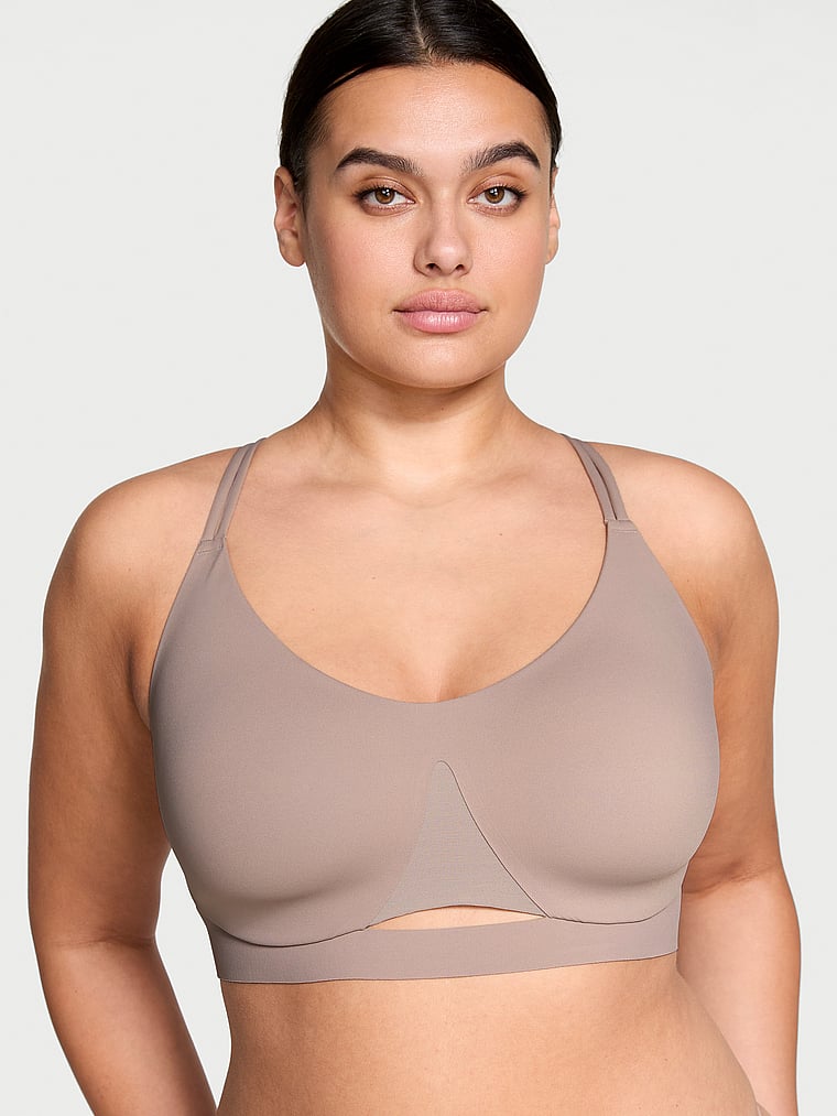 Victoria's Secret, VSX VSX Elevate™ Strappy-Comfort Sports Bra , Bare Taupe, onModelFront, 1 of 5 Karmi is 5'10" and wears 34DD (E) or Large