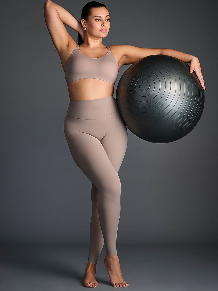 Victoria's Secret, VSX VSX Elevate™ Stretch-Comfort Sports Bra, Bare Taupe, onModelSide, 3 of 4 Karmi is 5'10" and wears 34DD (E) or Large