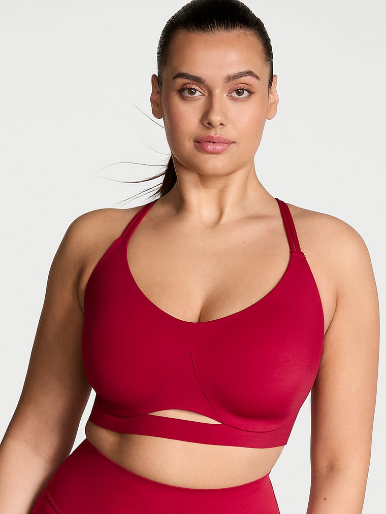Victoria's Secret, VSX VSX Elevate™ Strappy-Comfort Sports Bra , Red Lacquer, onModelFront, 1 of 4 Karmi is 5'10" and wears 34DD (E) or Large