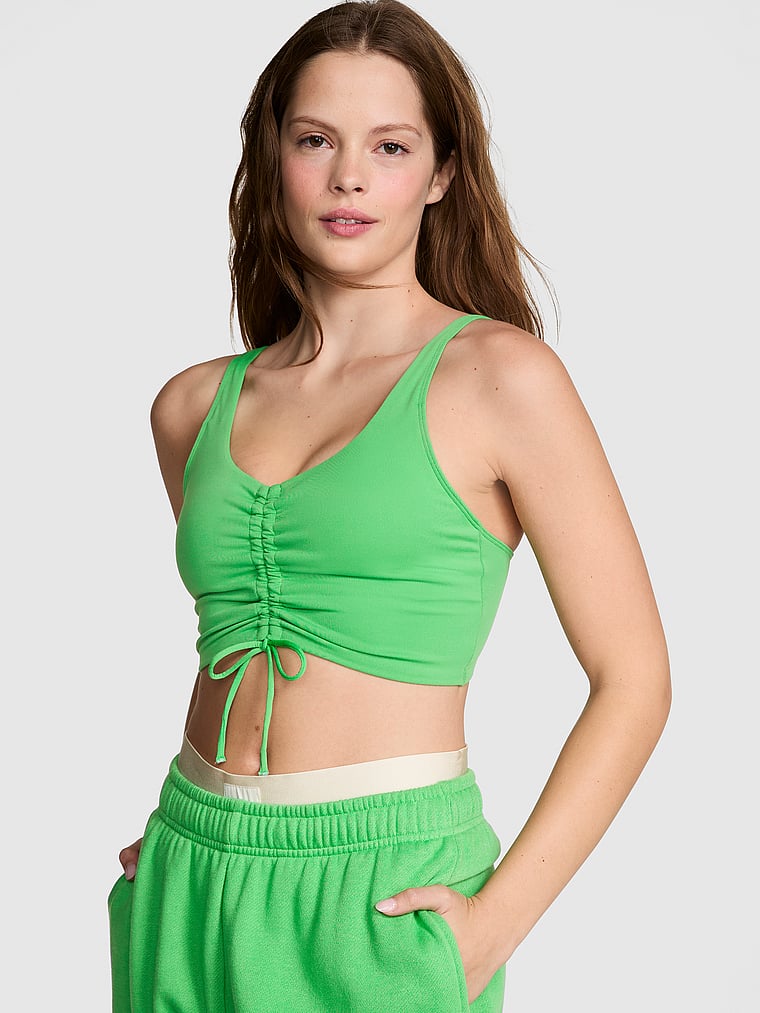 PINK Relay Ruched Plunge Sports Bra, Wild Green, onModelFront, 3 of 4 Taylor is 5'8" and wears 32B or Small