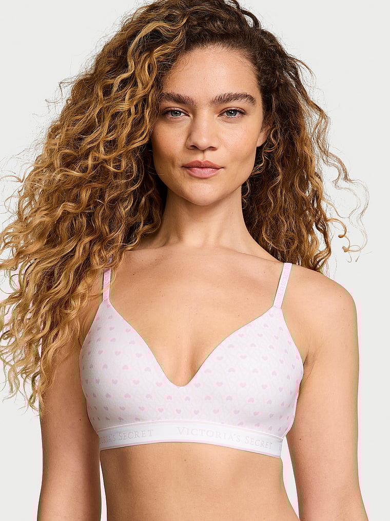 Victoria's Secret, The T-shirt Lightly Lined Wireless Bra, White & Pink Hearts, onModelFront, 1 of 4 Kiana is 5'9" or 175cm and wears 34B or Small