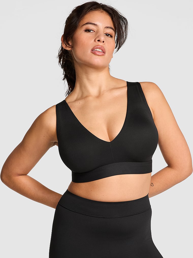 PINK Relay Strappy Plunge Sports Bra, Pure Black, onModelFront, 1 of 3 Isabella is 5'9" and wears 36B or Medium