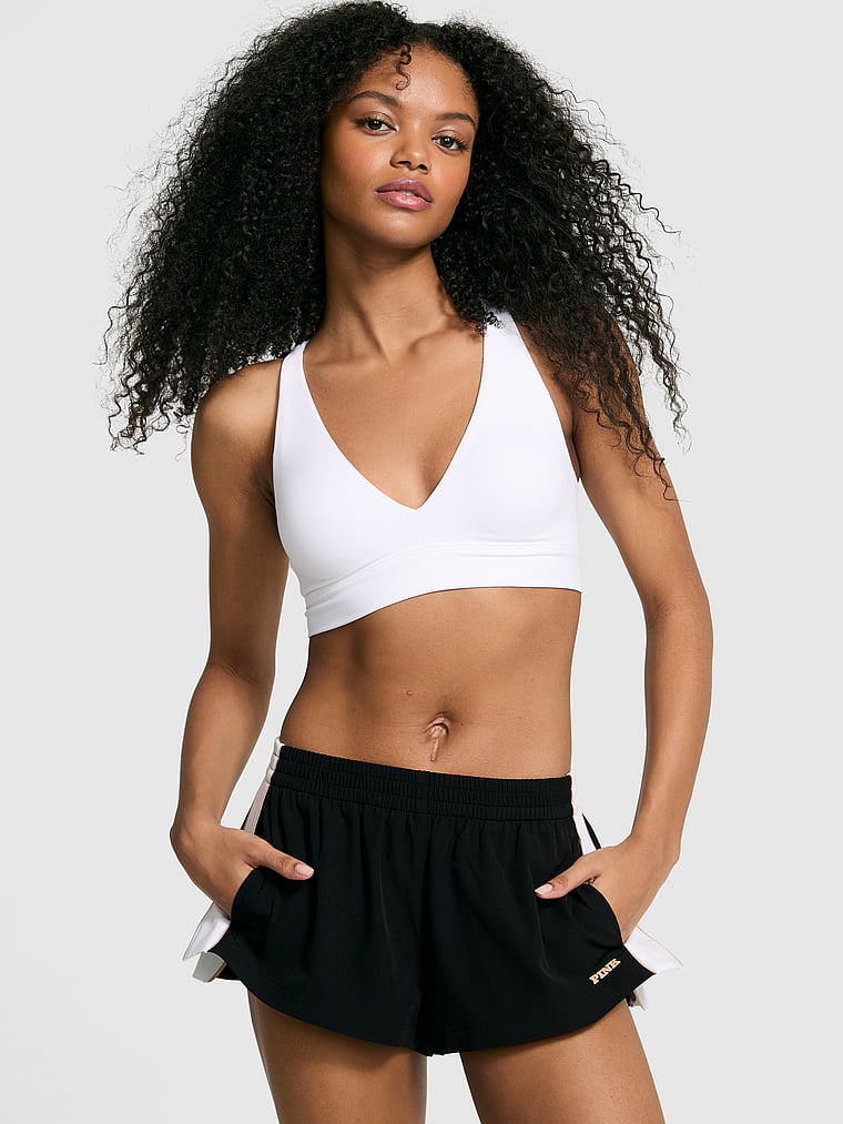 PINK Tech Woven Retro Shorts, Pure Black, onModelFront, 1 of 3 Jordan is 5'9" or 175cm and wears Small