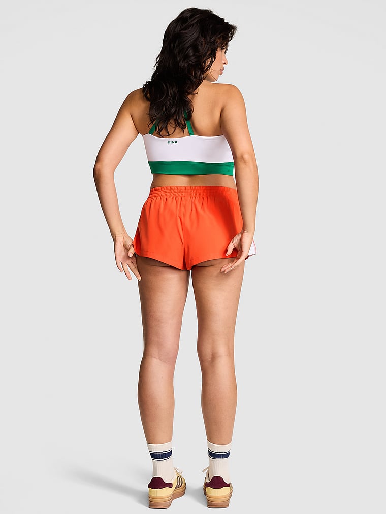 PINK Tech Woven Retro Shorts, Hot Orange, onModelBack, 4 of 4 Isabella is 5'9" and wears Medium