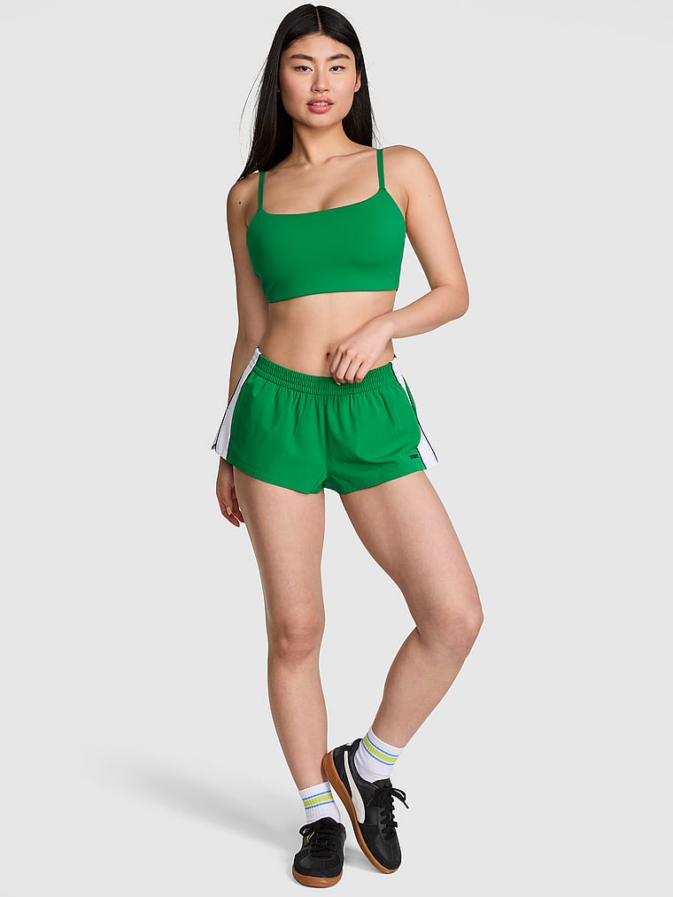 PINK Tech Woven Running Shorts, Verdant Green, onModelFront, 1 of 4 Gloria is 5'9" and wears Small