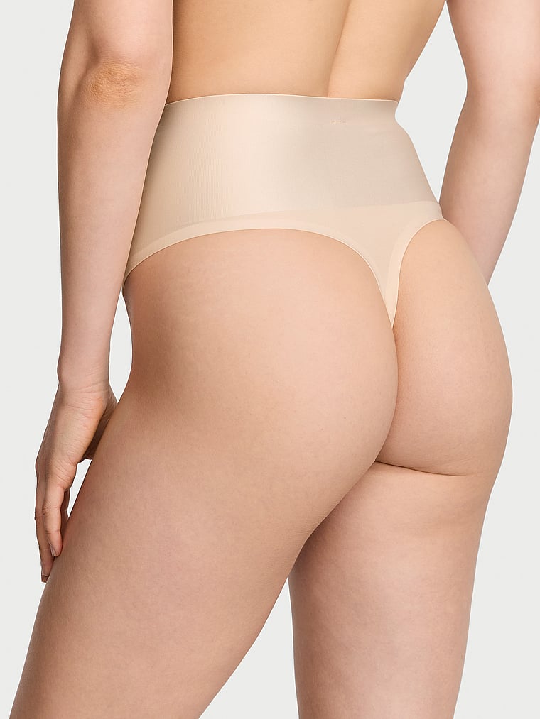 Victoria's Secret, Body by Victoria SmoothingShimmer™ Thong Panty, Marzipan, onModelBack, 2 of 3 Lotta is 5'10" and wears Small
