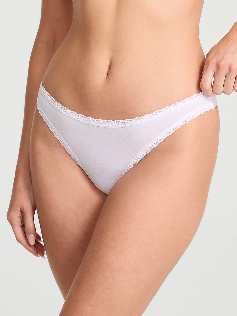 Victoria's Secret, Lace Trim Cotton Lace-Trim Sparkle Thong Panty, VS White, onModelFront, 1 of 3 Ari is 5'9" and wears Small
