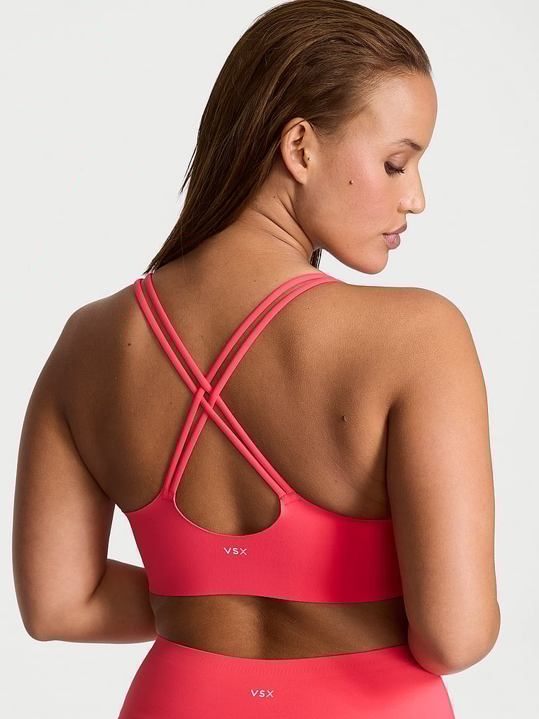 Victoria's Secret, VSX VSX Elevate™ Strappy-Comfort Sports Bra , Pink Island, onModelBack, 2 of 3 Sofia  is 5'8" and wears 36D or Large