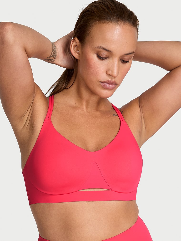 Victoria's Secret, VSX VSX Elevate™ Strappy-Comfort Sports Bra , Pink Island, onModelFront, 1 of 3 Sofia  is 5'8" and wears 36D or Large
