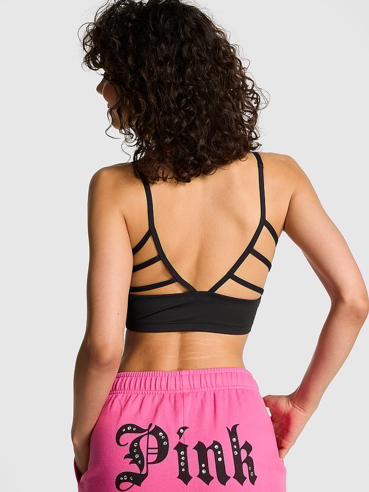 PINK Relay Criss-Cross Bra Tank, Pure Black, onModelBack, 2 of 5 Rae is 5'10" or 178cm and wears 34B or Small