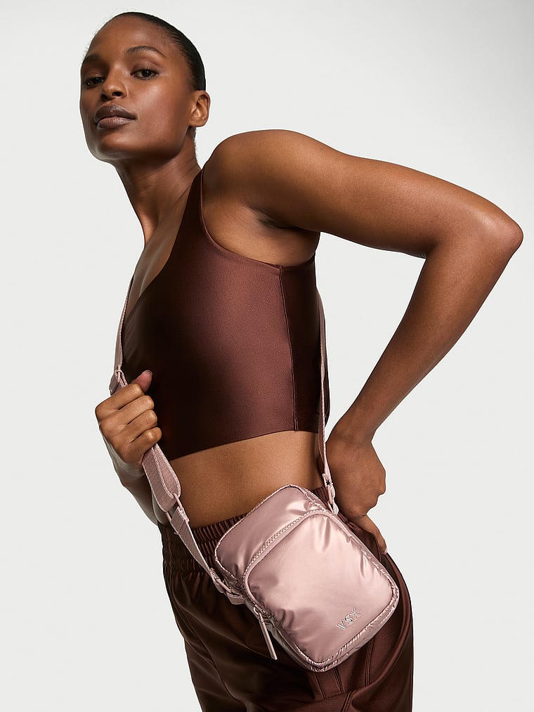 Victoria's Secret, Victoria's Secret VSX Glossy Phone Sling Crossbody Bag, French Mauve, onModelSide, 1 of 4