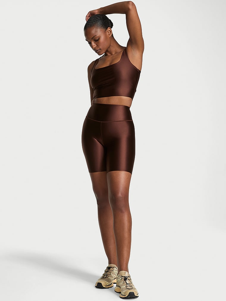 Victoria's Secret, VSX VSX GlossyTech™ 7" Bike Short, Ganache, onModelFront, 1 of 4 Tsheca is 5'9" or 175cm and wears Small