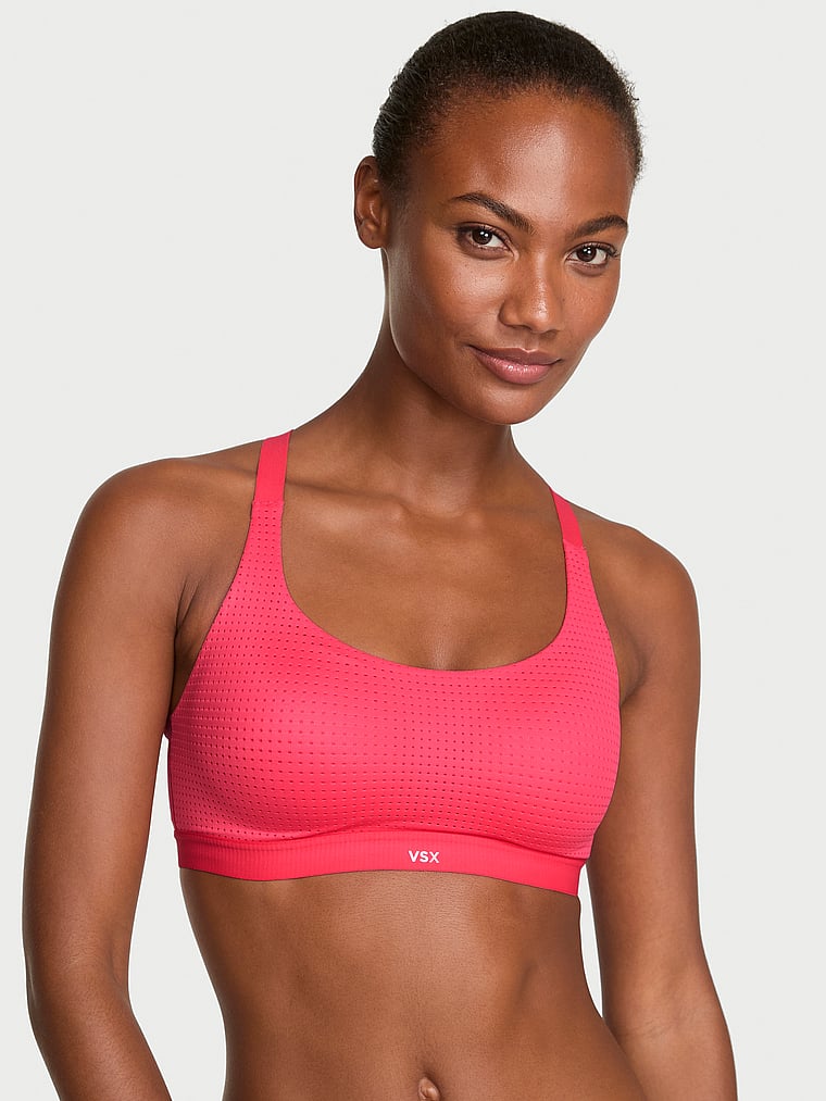 Victoria's Secret, VSX VSX Lightweight Mesh 2.0 Sports Bra, Pink Island, onModelFront, 1 of 3 Ange-Marie is 5'10" and wears 34B or Small