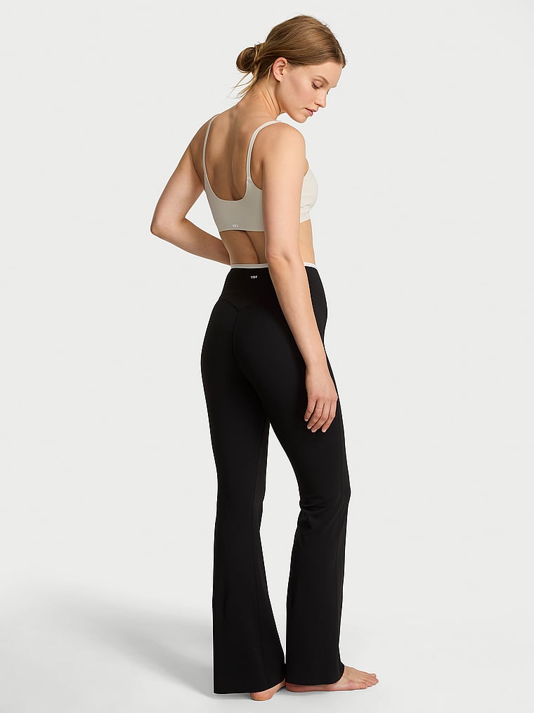 Victoria's Secret, VSX VSX Elevate™ Tipped & Accented Crossover Flare Legging, Black & Plaster, onModelBack, 2 of 4 Lotta is 5'10" or 178cm and wears Small