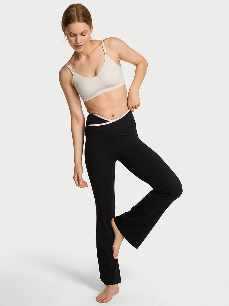 Victoria's Secret, VSX VSX Elevate™ Tipped & Accented Crossover Flare Legging, Black & Plaster, onModelFront, 1 of 4 Lotta is 5'10" or 178cm and wears Small
