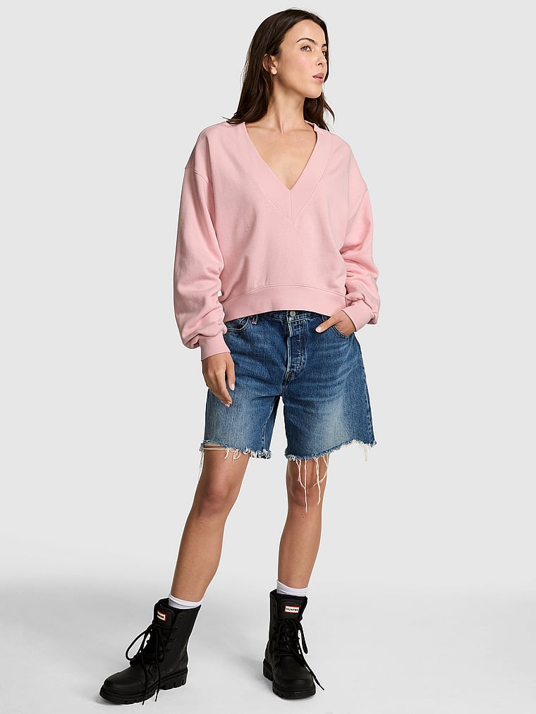 PINK Campus Fleece™ V-Neck High-Low Cropped Sweatshirt, Doll house, onModelFront, 1 of 4 Scarlett is 5'11" or 180cm and wears Small