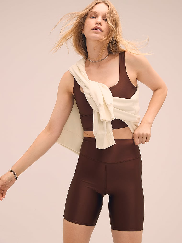 Victoria's Secret, VSX VSX GlossyTech™ 7" Bike Short, Ganache, onModelSide, 4 of 4 Lotta is 5'10" or 178cm and wears Small