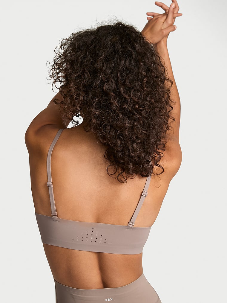 Victoria's Secret, VSX VSX Featherweight™ Light Balconette Sports Bra, Bare Taupe, onModelBack, 2 of 3 Tanya is 5'10" or 178cm and wears 32B or Small