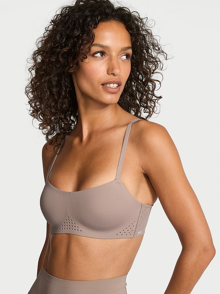 Victoria's Secret, VSX VSX Featherweight™ Light Balconette Sports Bra, Bare Taupe, onModelFront, 1 of 3 Tanya is 5'10" or 178cm and wears 32B or Small