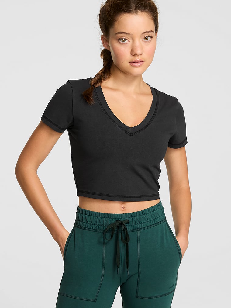 PINK All-Day Cotton V-Neck Cropped Tee, Pure Black Wash, onModelFront, 1 of 3 Ruby is 5'6" or 168cm and wears Small