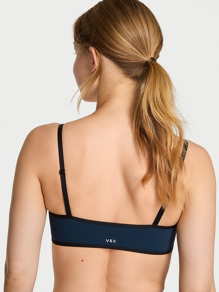 Victoria's Secret, VSX VSX Elevate™ Tipped & Accented Balconette Sports Bra, Impact Blue, onModelBack, 2 of 6 Lotta is 5'10" and wears 34B or Small