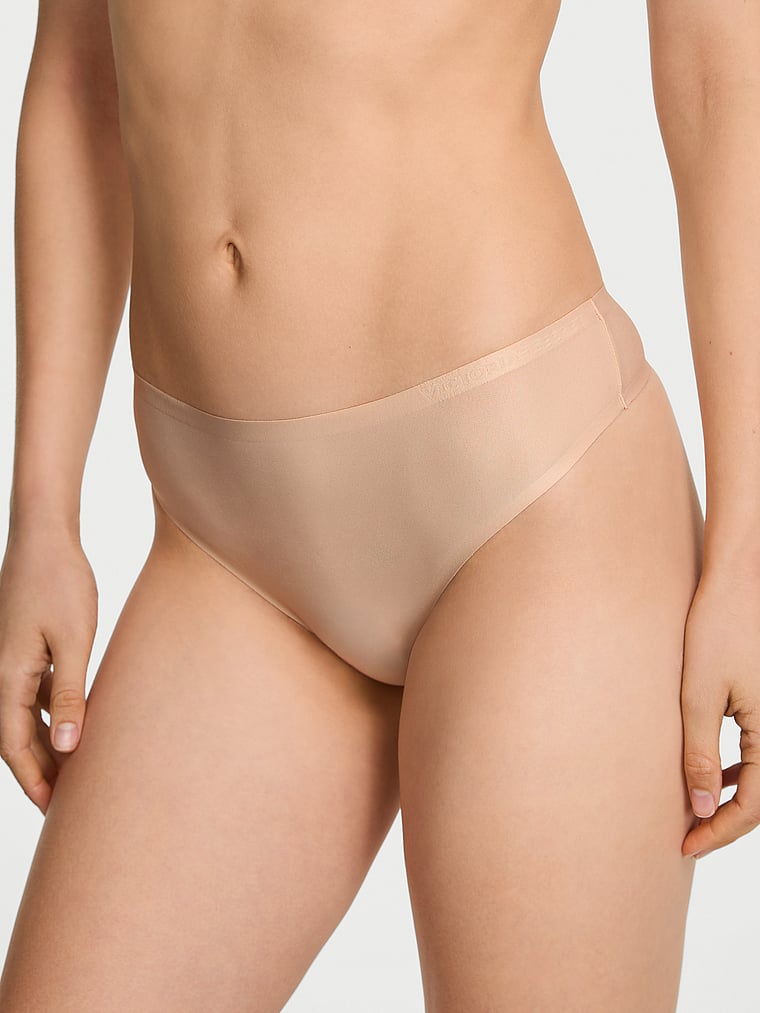 Victoria's Secret, Body by Victoria Body by Victoria Flex Shimmer Mid-Rise Thong Panty, Praline, onModelFront, 1 of 3 Lotta is 5'10" and wears Small