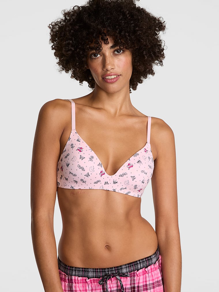 PINK Wear Everywhere Wear Everywhere Lightly Lined Wireless Bra, Pink Tulip Tattoo Print, onModelFront, 1 of 3 Vanessa is 5'10" and wears 32B or Small