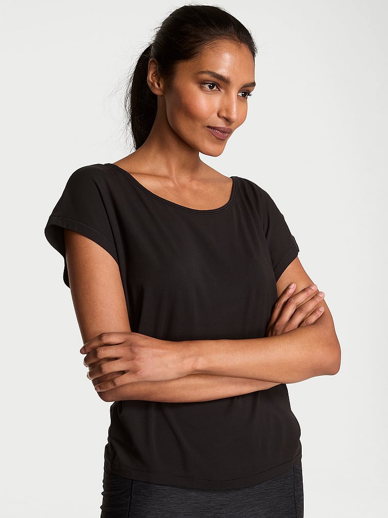 Victoria's Secret, VSX VSX Drapey Knit Open-Back Tee, Black, onModelFront, 1 of 3 Shaanti is 5'9" or 175cm and wears Small