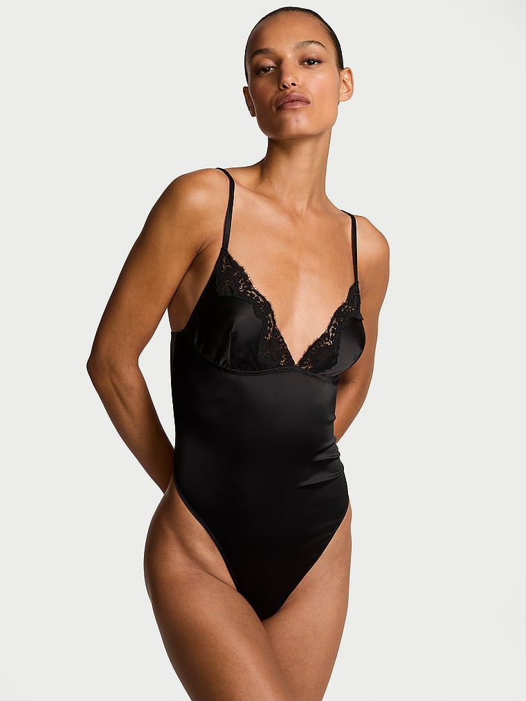 Victoria's Secret, Dream Angels Satin Lace-Trim Bodysuit, Black, onModelFront, 1 of 4 Nikita is 5'10" and wears 34B or Small