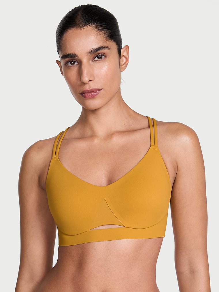 Victoria's Secret, VSX VSX Elevate™ Strappy-Comfort Sports Bra , Gold Standard, onModelFront, 1 of 6 Anisha is 5'11" and wears 34B or Small