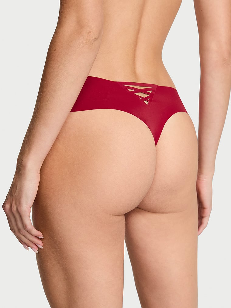 Victoria's Secret, No-Show No Show Strappy Thong Panty, Red Lacquer, onModelBack, 2 of 3 Ari is 5'9" or 175cm and wears Small