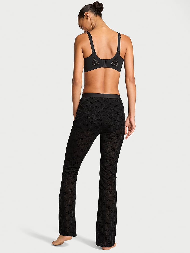 Victoria's Secret, VSX VSX Flocked Logo Mesh Flare Pant, Black, onModelBack, 2 of 5 Nikita  is 5'10" or 178cm and wears Small