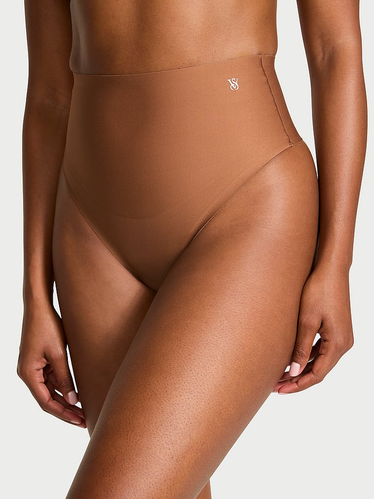 Victoria's Secret, Victoria's Secret Shapewear by Victoria InvisibleSculpting™ Thong Panty, Caramel, onModelFront, 1 of 3