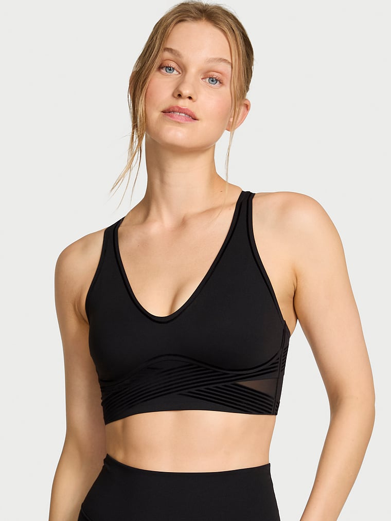 Victoria's Secret, VSX VSX Elevate™ Refined Contours Plunge Sports Bra, Black, onModelFront, 1 of 5 Lotta is 5'10" or 178cm and wears 34B or Small