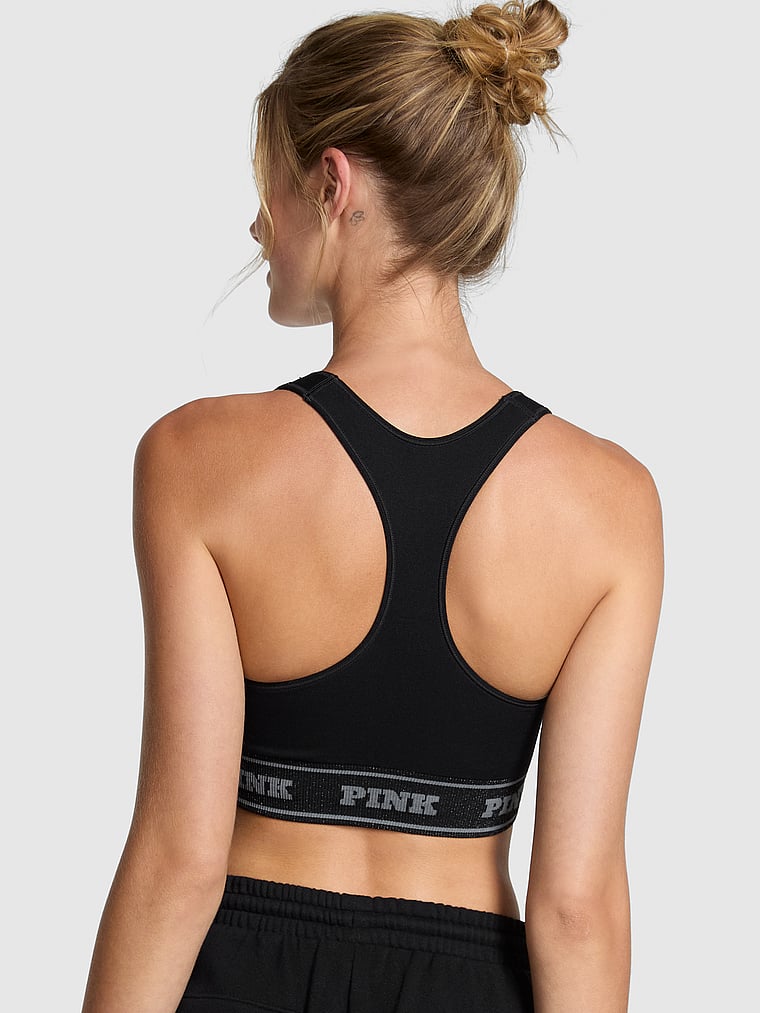 PINK Seamless Reversible Sports Bra, Pure Black Lurex Bows, onModelBack, 2 of 4 Mari is 5'7" or 170cm and wears 34B or Small