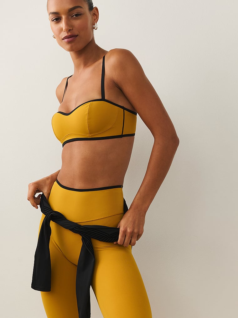 Victoria's Secret, VSX VSX Elevate™ Tipped & Accented Balconette Sports Bra, Gold Standard, onModelSide, 4 of 5 Nikita  is 5'10" or 178cm and wears 34B or Small